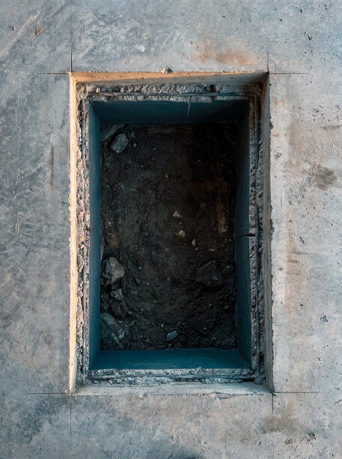 Illustration: a rectangular opening saw-cut through a basement slab