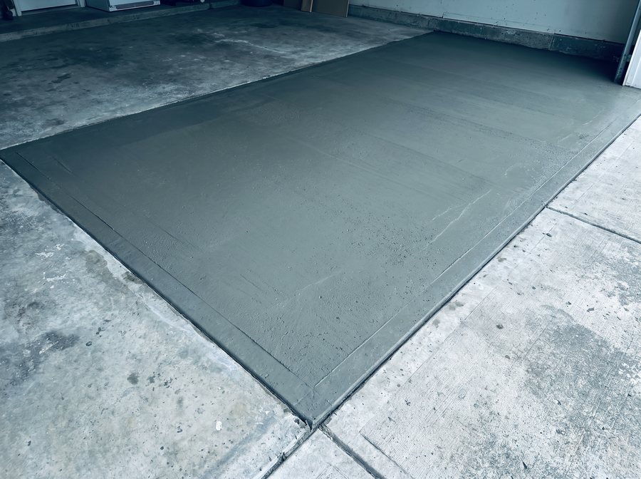 Illustration: a replaced slab section finished flush in a garage floor